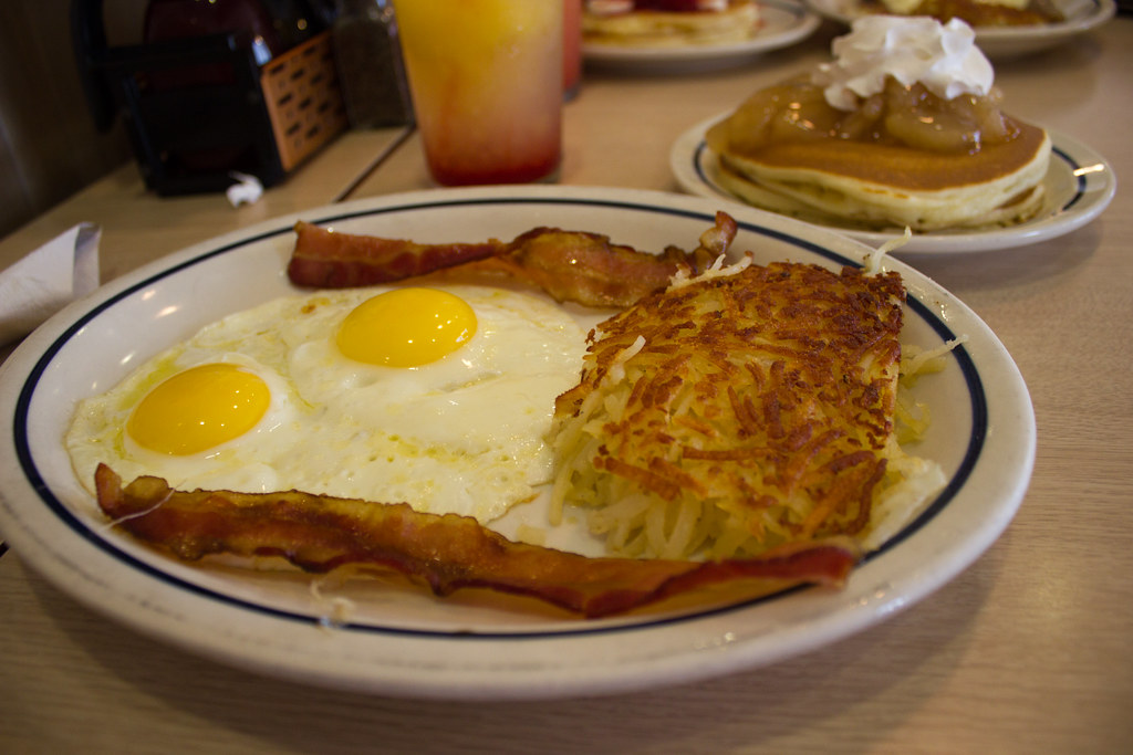 "Pancakes, eggs, bacon & hash browns at IHOP" by vagueonthehow is licensed under CC BY 2.0. To view a copy of this license, visit https://creativecommons.org/licenses/by/2.0